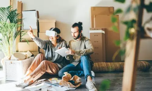 Unlocking the Potential of Augmented Reality in 3D Visualizations. Happy young couple planning interior design in virtual reality.
